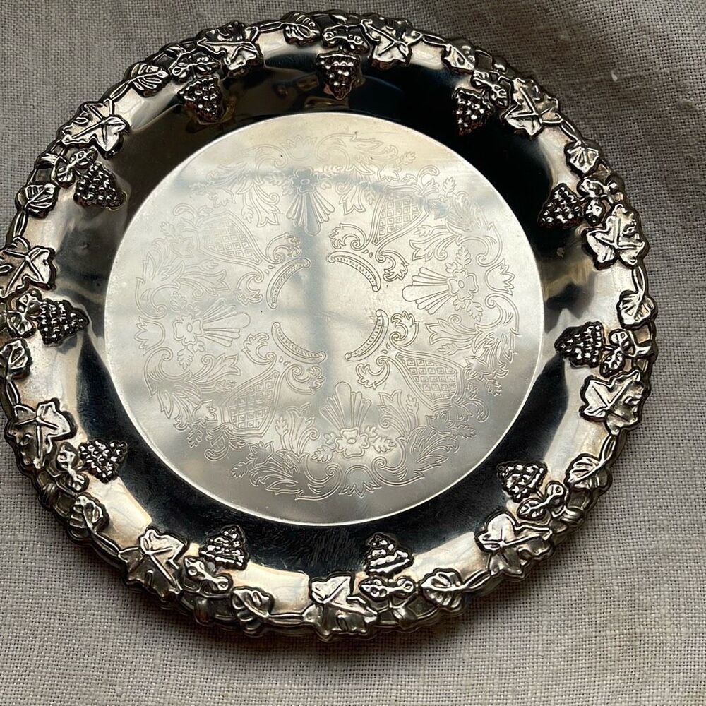 VTG Hong Kong etched grape leaves wine bottle coaster.
